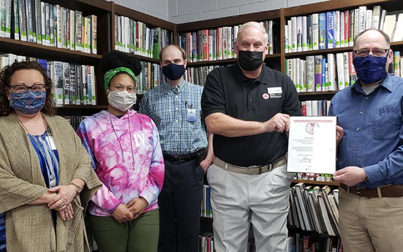 Pictured from left is library staff Bobbie Sue Smiley, Alexis Faciane and Benjamin Ossoff with American Red Cross representative John Clodfelter and Librarian Jeff Delfield.
