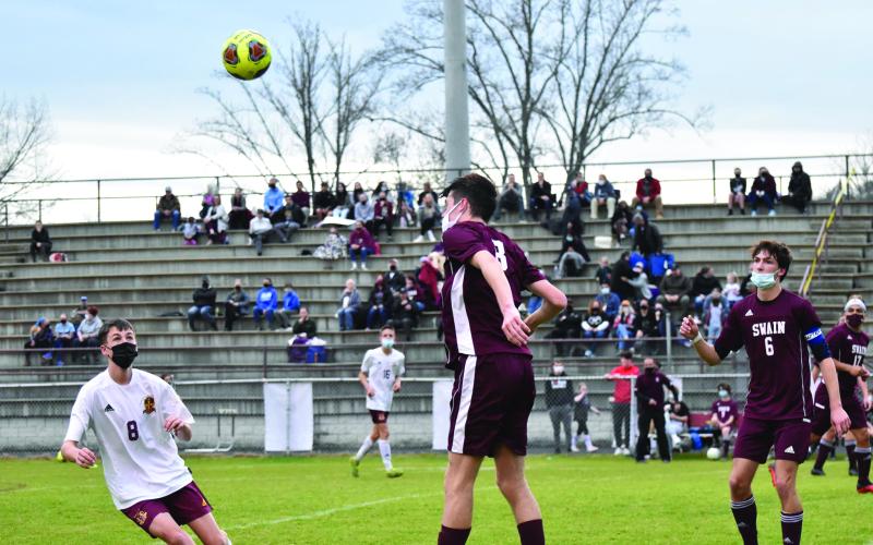 Levi Trantham jumps up to head the ball in last week’s game.