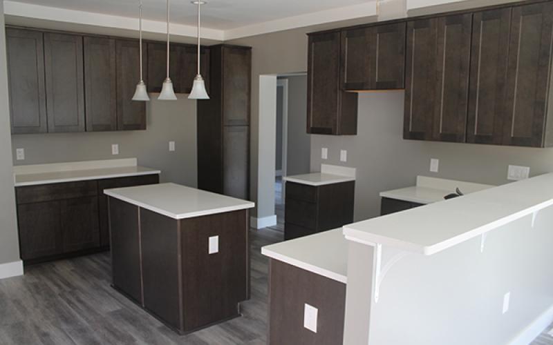 The kitchen in what will be the sales house for Kituwah Homes provides a look into the high-end standard features to be included in the houses, such as granite countertops.