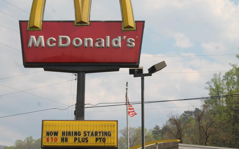 Fast food restaurants like McDonalds, pictured, are offering $10 or more an hour for new hires.