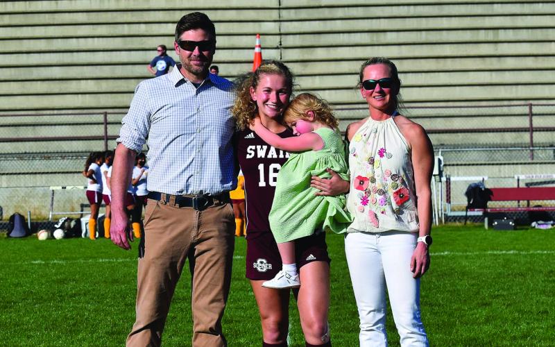 Senior Kate Poss led the Lady Devils in clears/steals this season. She’s pictured with family.