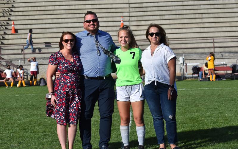 Senior Maddie Lay, team goalie, was among the seniors to take the field Monday evening to be recognized for Senior Night. She’s pictured with family.