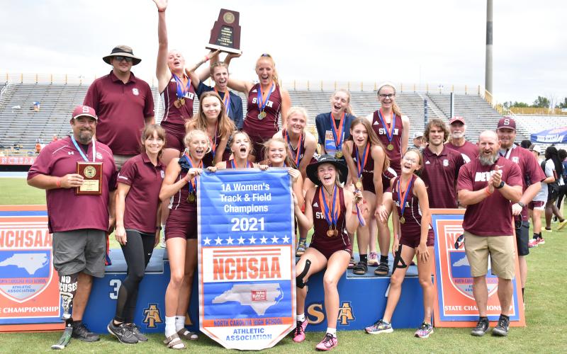 Lady Devils with coaches after winning state