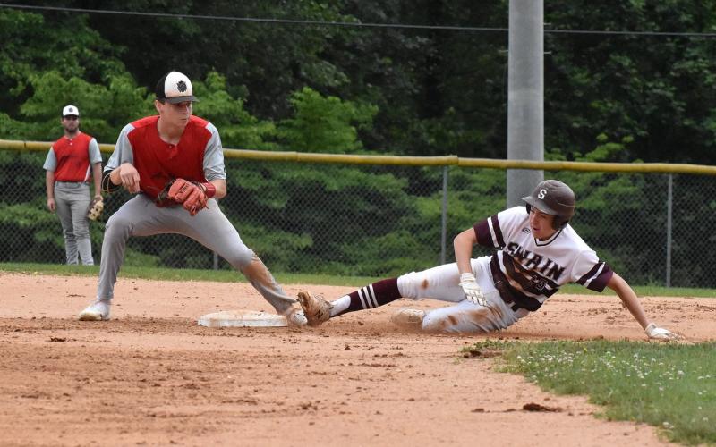 Maroon Devil Cooper Hyatt, junior, slides safely to base in the home win over Andrews Friday night.