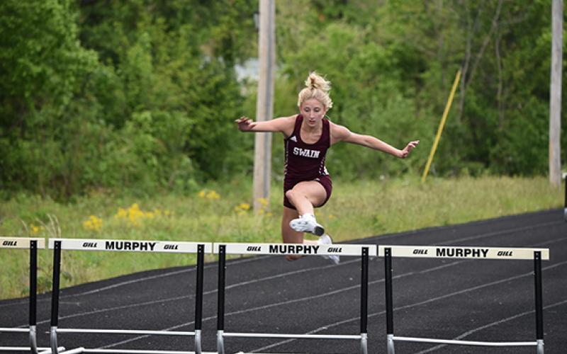Jessica Lohmann clears a hurdler.