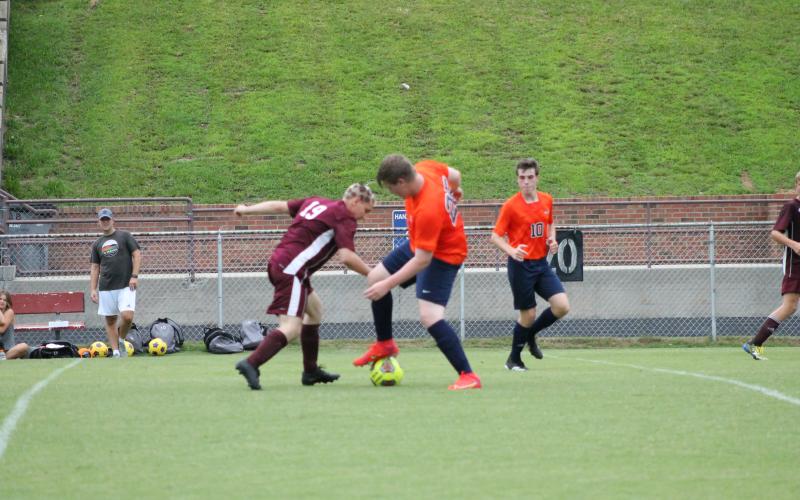 Adam Cotterman battles it out for the ball in the Invest game