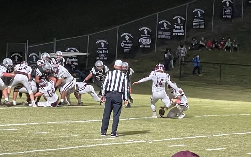 Maroon Devil Gavin Lanning kicks a good point after a Devils touchdown in the 31-14 away loss to Robbinsville on Tuesday night. The team will host Cherokee on Friday.