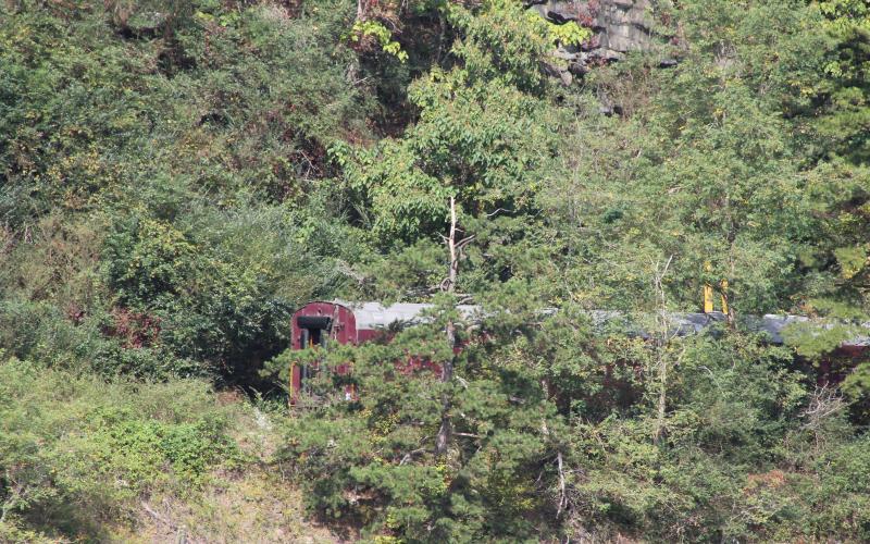 The train cars can be seen off the track Monday