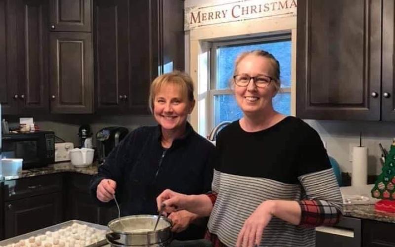From left, Stephanie Rose and Ona Huskey making their famous Christmas candy.