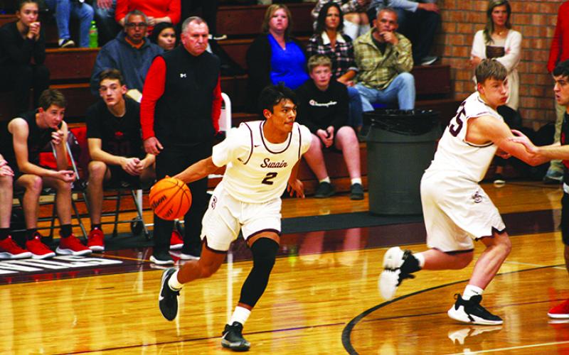 Maroon Devil Donnavin Groenewold looking for an opening to shoot through to the basket.