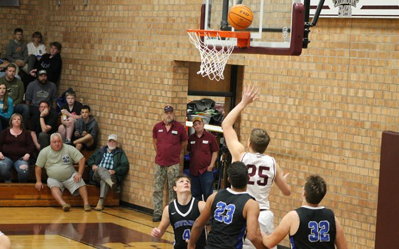 Isaiah Collins gets a basket in the winning game against the Mustangs