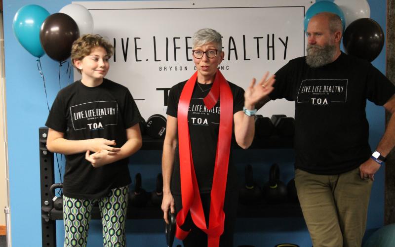 Shannon Royce, center, thanked her daughter Kenzie and husband Chris for all their help with opening her personal training studio, Live Life Healthy TOA,  during a ribbon cutting ceremony held Dec. 10.