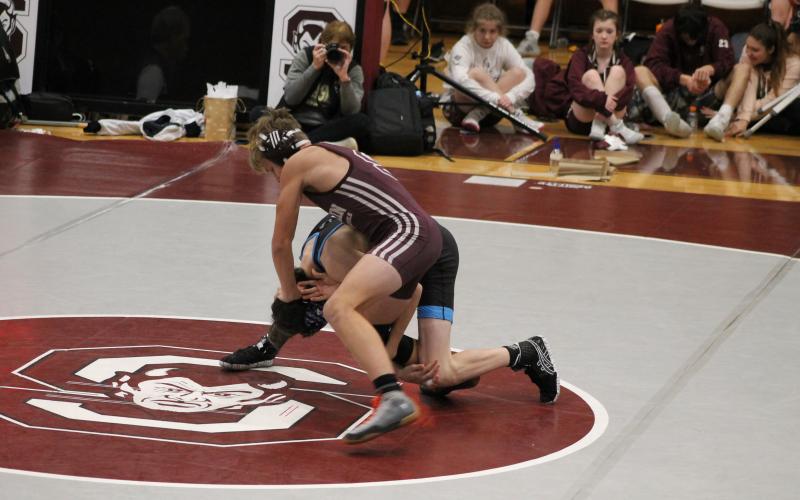 Owen Craig takes down an opponent from Enka Jets at the Devils Duals.
