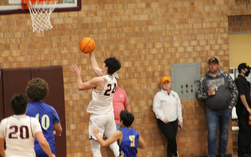 Nathan Bogdanowicz goes up for a layup against Highlands