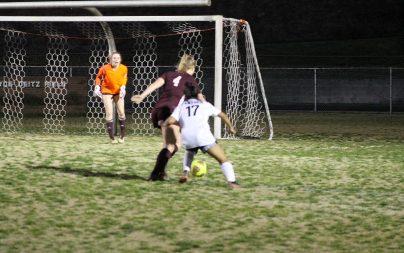 Anna Gray helps defend the Lady Devil turf during the season opener on Monday night. Gray was named Player of the Game.