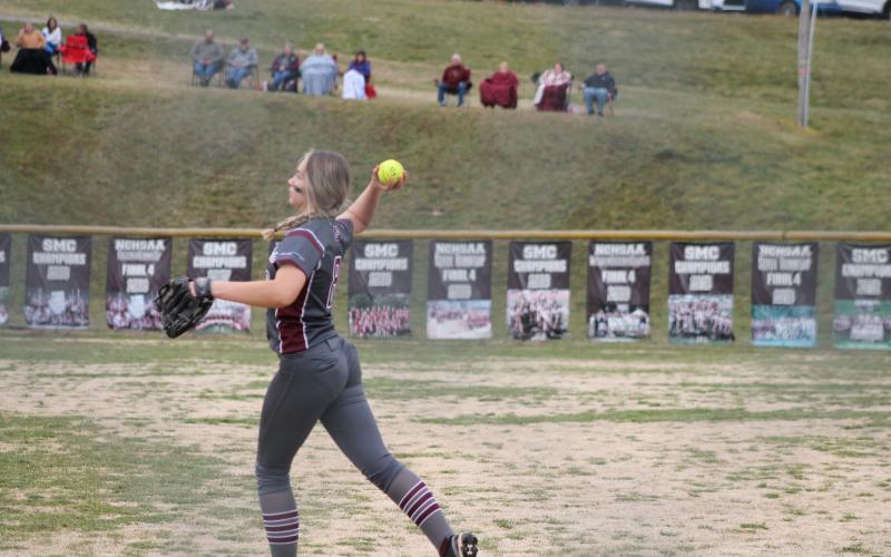 Junior Tori Johnson throws the ball to first base from outfield