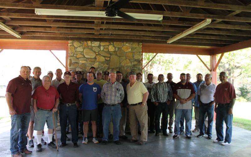 Past and present: Former Swain High School football head coaches and assistants gathered together to welcome the newly named head football coach, Sherman Holt (far left).