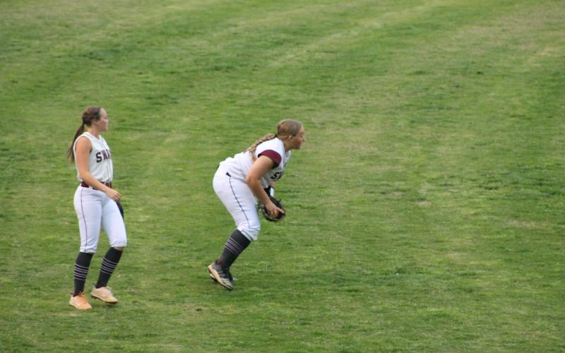 Faith Woodard gets a ground ball as Kiersten Smith backs her up