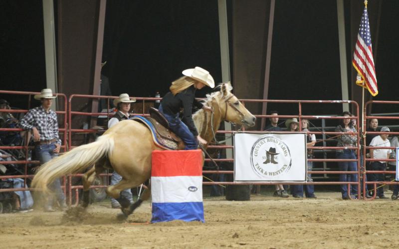 A horseback rider shows off