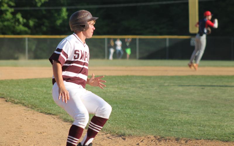 Senior Gavin Lanning lands on third base looking toward home at the championship tournament vs. Union Academy.