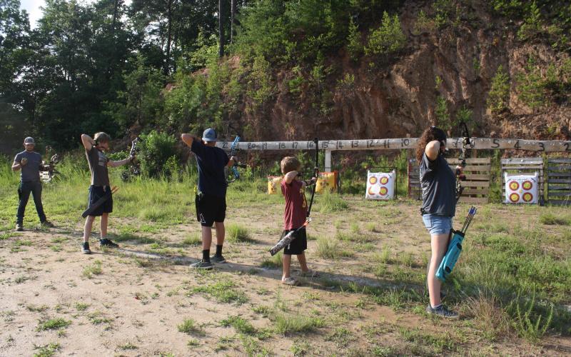 (From left) Kory Ledford, Kadin Taylor, Marcus Fisher, Xander Litzau, and Kianna Parton shoot from the 10-yard line. Archers pictured range in age from 9-16.