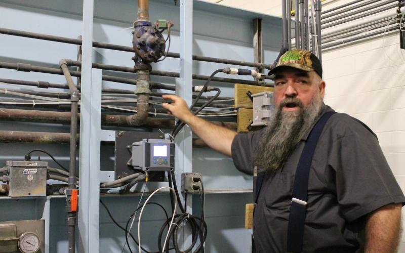 Russell Ball, supervisor and operator in responsible charge at Town of Bryson City water plant, goes over the details of how the plant processes water.