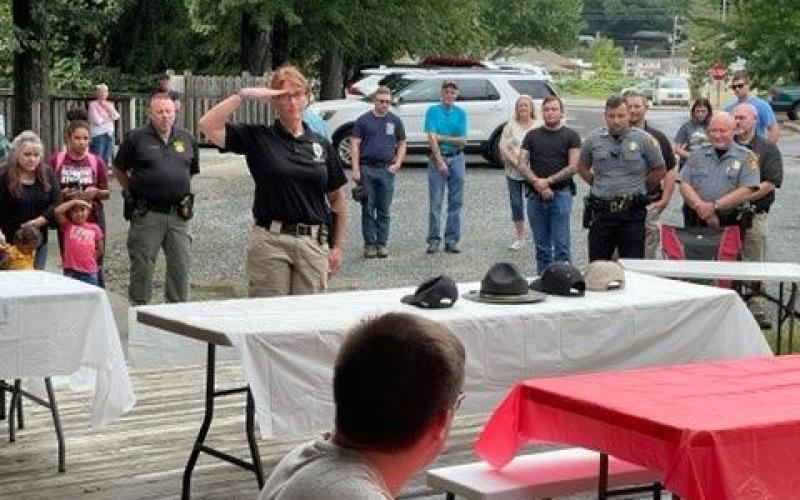 Swain County Probation Officer Melissa Massie pays respect in the Table of Honor Ceremony.