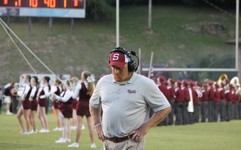 Maroon Devil Head Coach Sherman Holt looks tense during the tough game against Dade County.