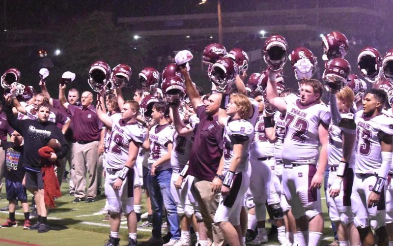 the team celebrates after the close victory over the Panthers