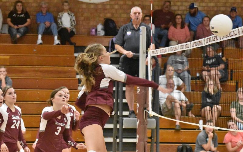 Lady Devil Kinsley Hyatt spikes the ball during the 3-0 win against Nantahala.