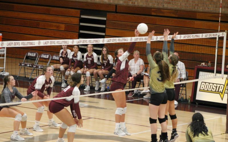 Kennedy Anthony taps the ball over the net at the home game against Hayesville last week.