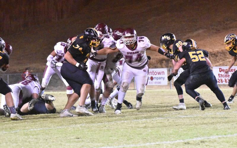 Maroon Devil defensive line prevents the Bulldogs from gaining yards with Ashton Baul on the tackle #58, and Nolan Fisher #74, Aiden Curtis #55, Braylon Aldridge #54 and Josiah Glaspie 13 clearing the Bulldogs line.