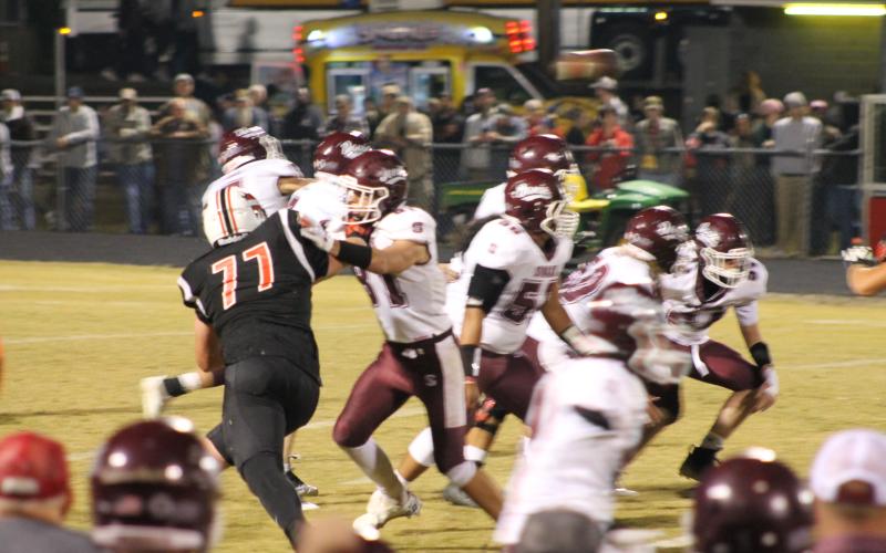 Maroon Devil Nathan Bogdanowicz and other defensive players going after the Andrews Wildcats.