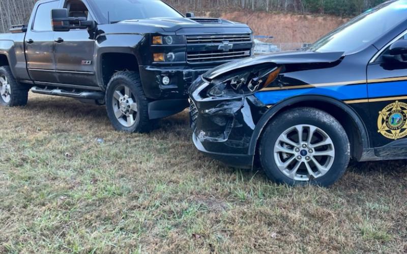 Officer Hampton’s patrol car and the offender’s truck after the chase finally ended when officers surrounded the truck prevented the driver from fleeing again.