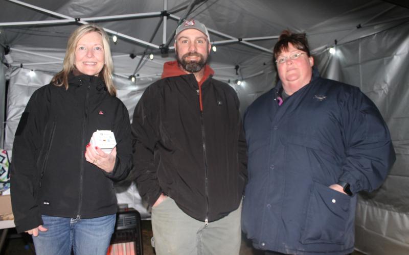 From left, Cindi Woodard, Cabbott Cochran and Missy Sutton volunteer at the Christmas Spectacular to benefit local nonprofits including Swain Cancer Support.