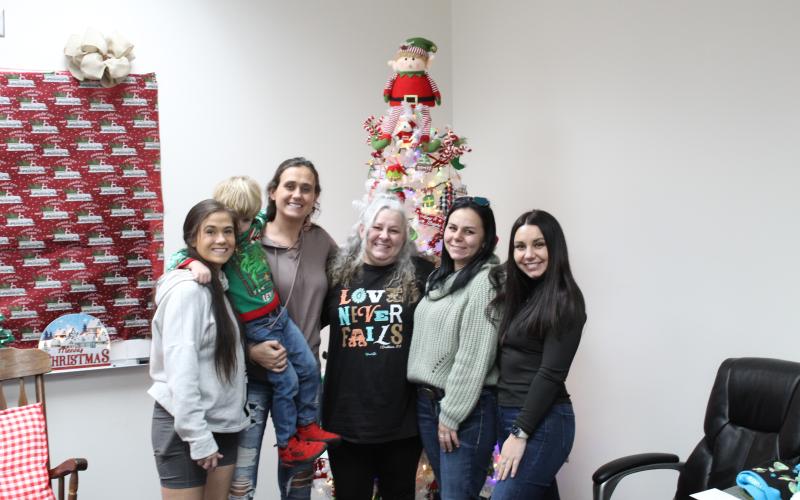 Inmates and their families have been all smiles at the Swain County jail, as they join together in the decorated conference room to gift gifts to children and spend precious time together.