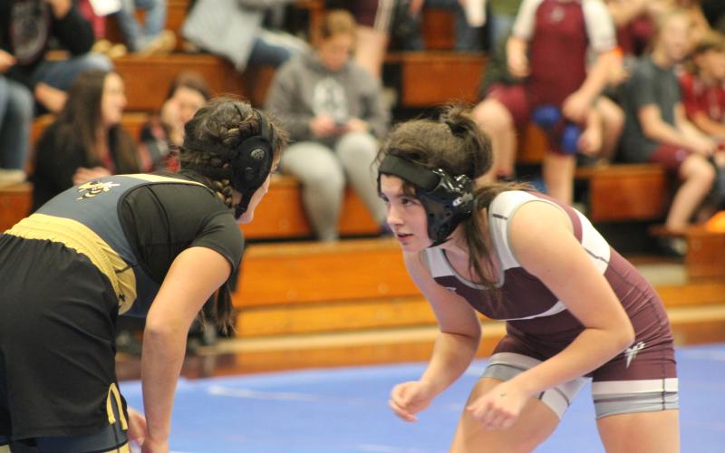 Lady Devil Brianna Wesley faces off against a Hayesville Yellow Jacket. Swain’s girls won their match with Hayesville 60-12.