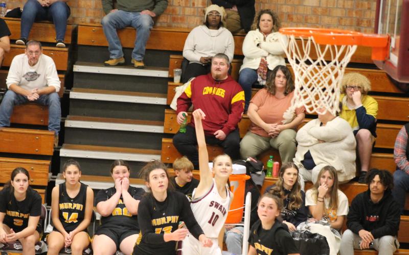 Mya Burrows Kurr goes for a 3-point shot in the battle against Lady Bulldogs