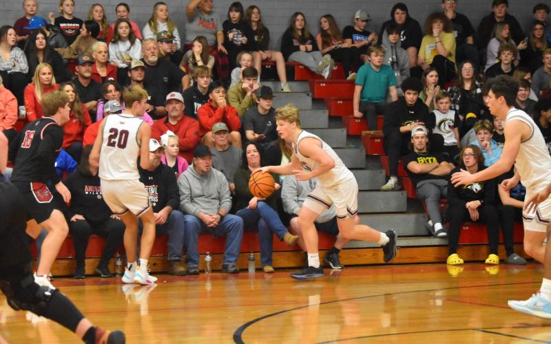 Maroon Devil Joshua Collins drives the ball up the court.