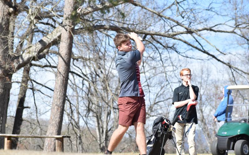Swain County High golf team member Clay Seagle takes a swing competing in Robbinsville last week.