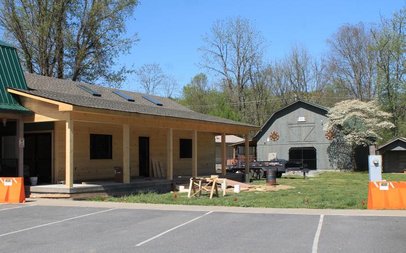The Fly Fishing Museum of the Southern Appalachians is moving to its new location on Island Street to open next month. The new building, pictured above, is modeled after a log cabin and was built by county workers.