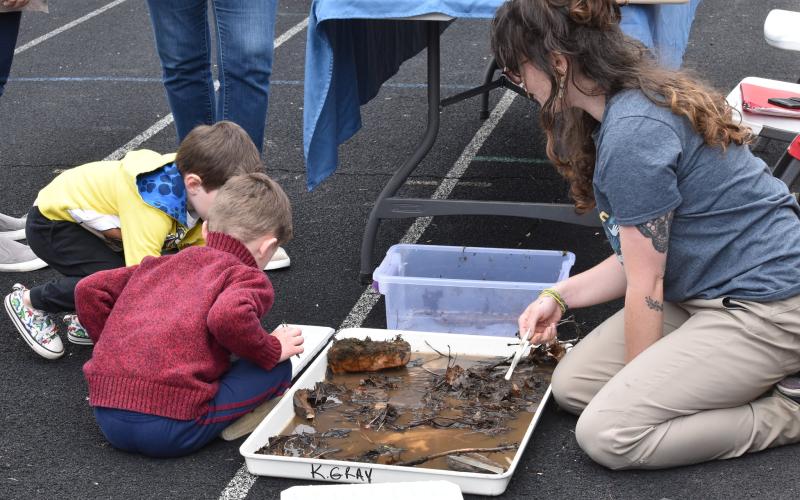 Children participate in an hands-on activity hosted by the Great Smoky Mountains National Park at a previous Swain High Science Club Earth Day Celebration.