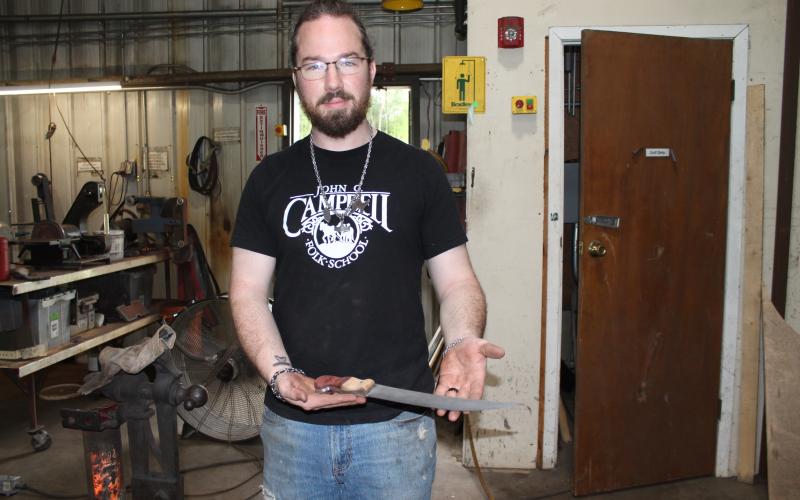 Jesse Bolding, an apprentice blacksmith at the Green Energy Park, makes all manner of swords, weapons and metal craft