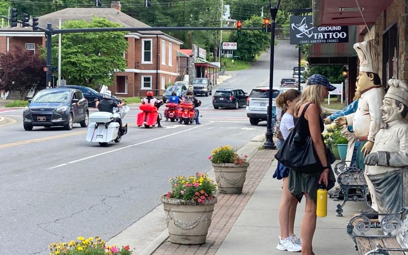 Visitors to Bryson City look at the menu outside Pasqualino's Italian Restaurant on Tuesday.