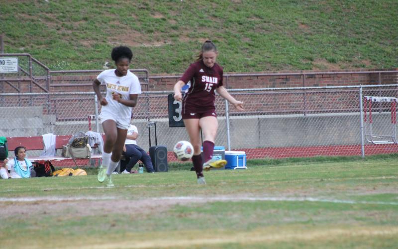 Lady Devil Karena Cline battles for the ball at Monday’s playoff game.