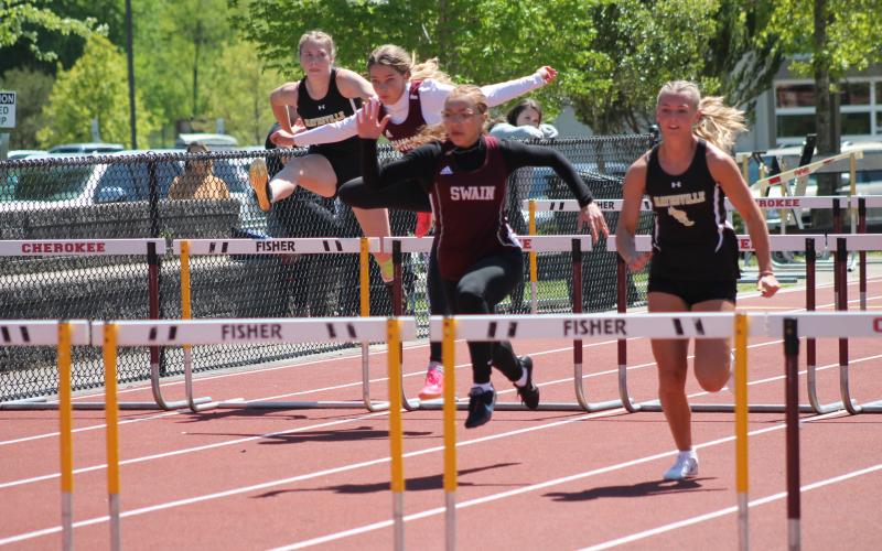 Lady Devils Melanie Linton (lead) and Kinsley Hyatt participating in one of the hurdle relay events at the SMC Track &amp; Field Championships on May 3.