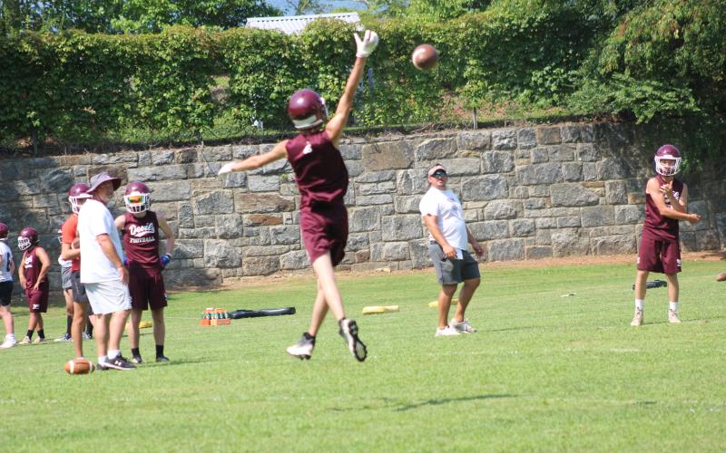 A football player gets some air catching the all