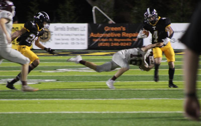 Sophomore Andrew Cody makes a tackle against one of the Mountaineers at the game in Tuscola on Friday, Sept. 8. Swain County won the game 30-26.