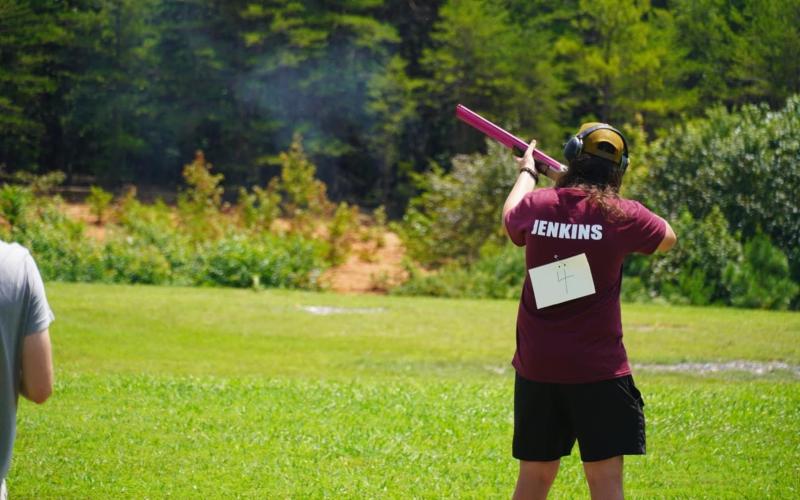Swain competes in shooting