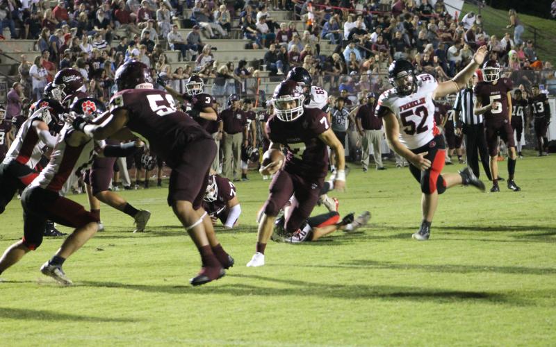 Maroon Devil James Stroman tries to outrun opponents at the Sept. 1 game played at home.